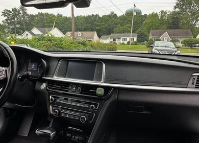 Car interior at REDEFINE AUTO DETAILING, LLC, Albany, New York, US showcases a pristine dashboard and steering wheel.