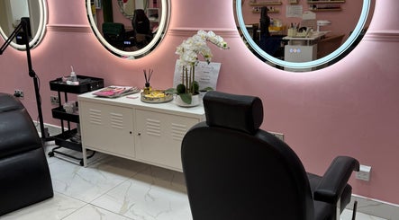 Chic salon chair and decor at Nicole’s Dolls House, London, England, GB with a stylish pink theme.