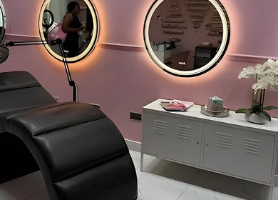 Chic beauty setup at Nicole’s Dolls House, London, England, GB with pink walls and luxurious decor.