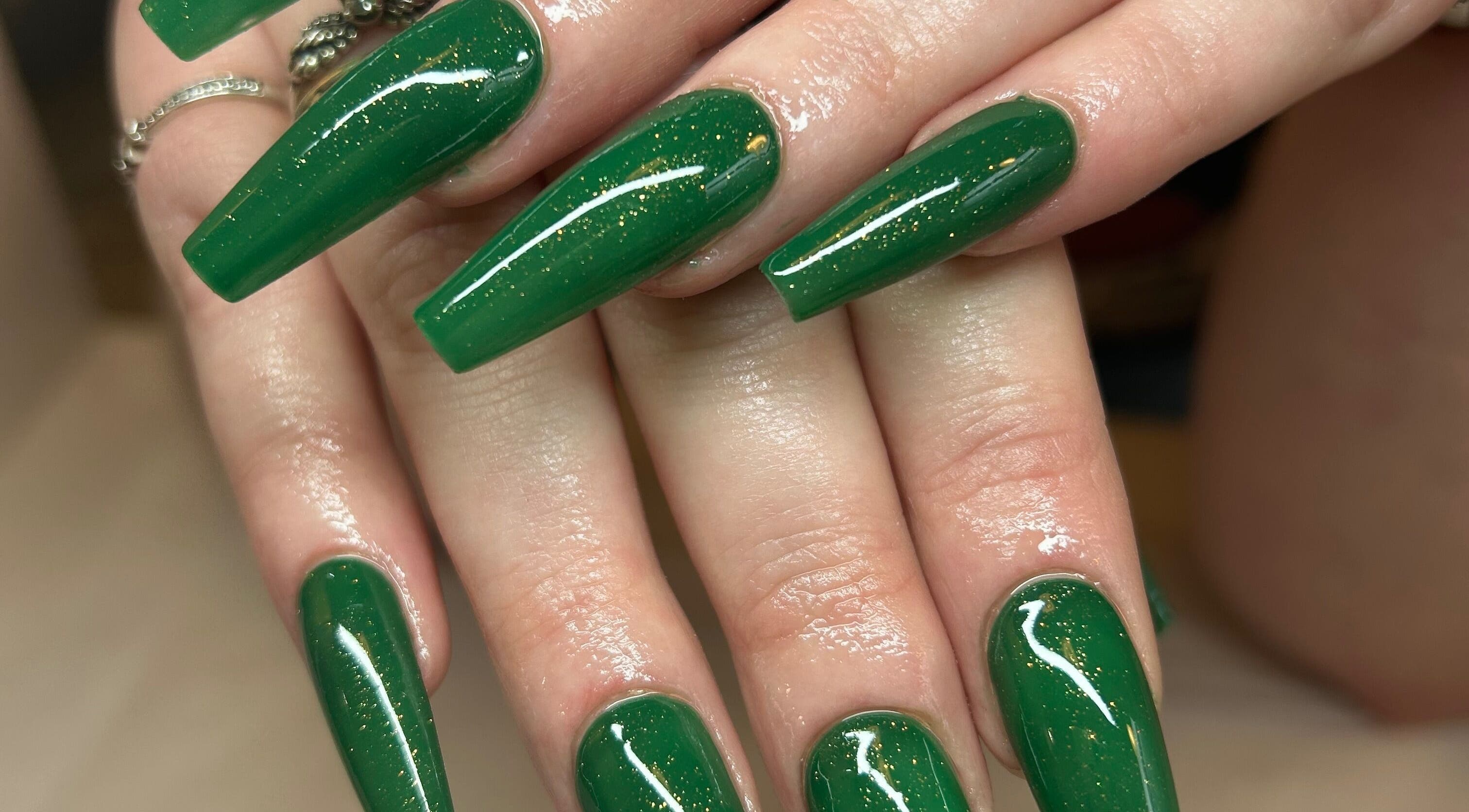 Stylish green nails with glitter at Bellissimo Nails and Beauty, Brierley, England, GB.