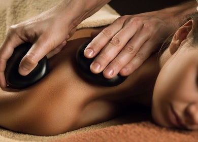 Relaxing hot stone massage at AMATA MASSAGE STUDIO in Toronto, Ontario, CA offering soothing wellness treatments.
