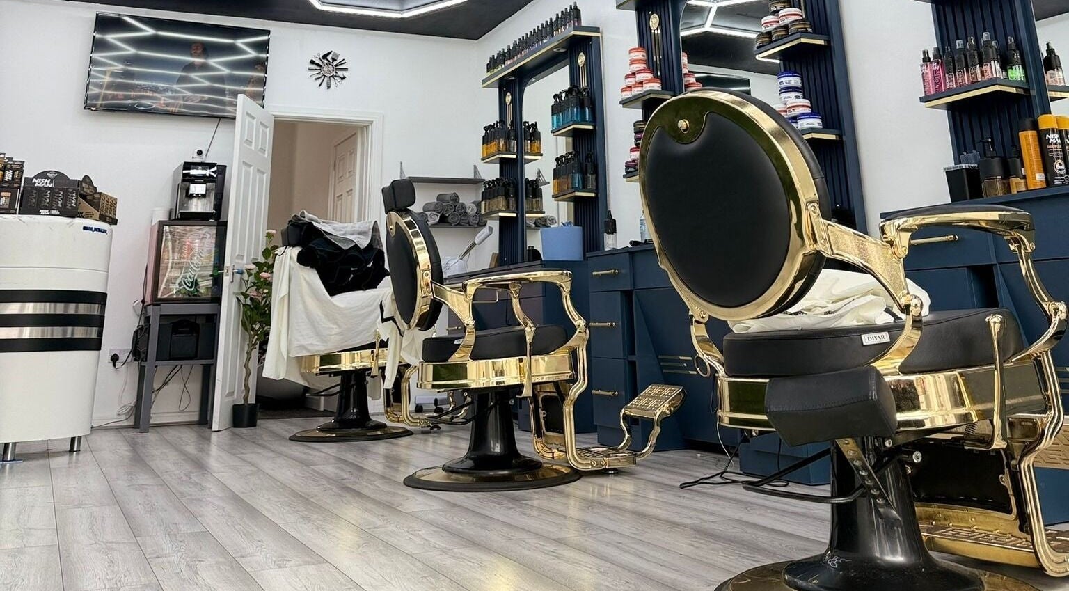 Elegant interior of Karo Barber in Hindley, England, GB featuring luxurious barber chairs and modern decor.