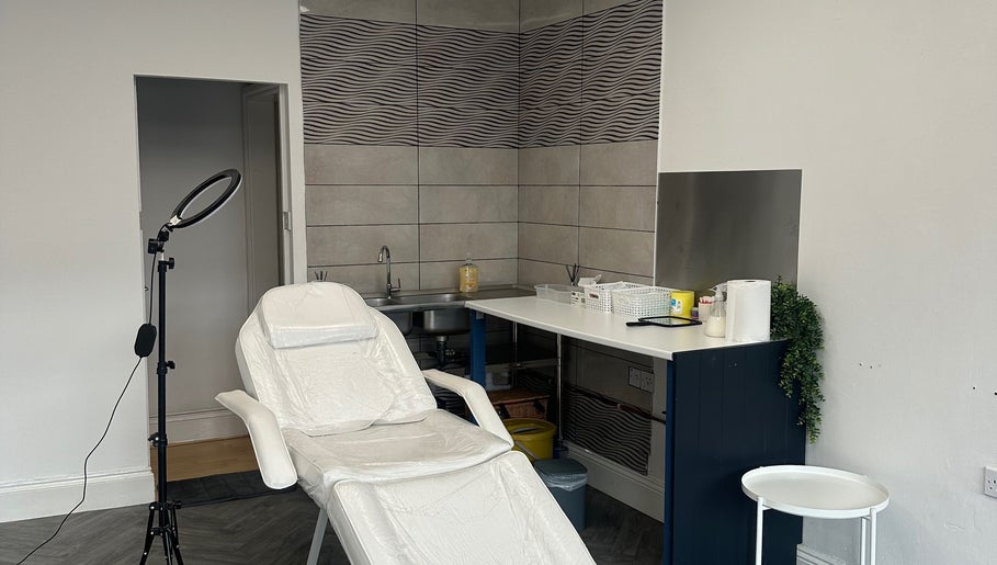 Cozy treatment room at Eilise Jane Aesthetics, Southampton, England, featuring a reclining chair and modern decor.