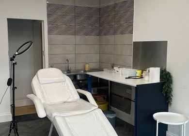 Cozy treatment room at Eilise Jane Aesthetics, Southampton, England, featuring a reclining chair and modern decor.