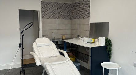 Cozy treatment room at Eilise Jane Aesthetics, Southampton, England, featuring a reclining chair and modern decor.