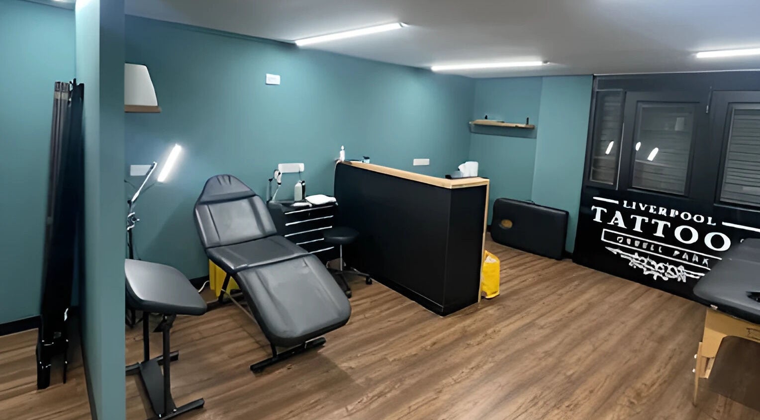 Modern tattoo room at Liverpool Tattoos & Piercings Orrell Park, Liverpool, England, GB with professional setup.