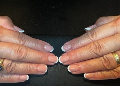 Elegant French manicure at LT Hair And Beauty, Bideford, England, GB showcasing professional nail artistry.