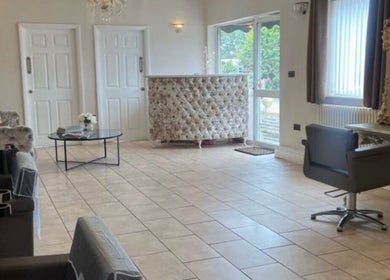 Stylish interior of Natalia's Hairistry in Frampton Cotterell, England, GB featuring chic furnishings.