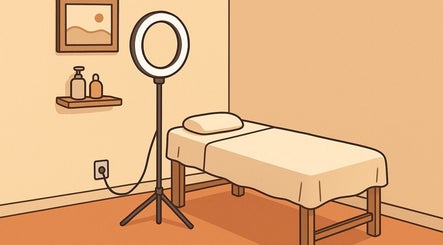 Cozy treatment room at Bloom Lash & Esthetics, Pocatello, Idaho, US, with massage bed and soft lighting.