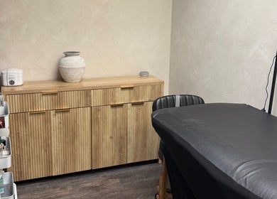 Treatment room at Bloom Lash & Esthetics in Pocatello, Idaho, US with modern decor and comfortable treatment table.