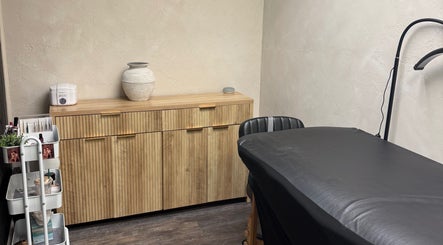 Treatment room at Bloom Lash & Esthetics in Pocatello, Idaho, US with modern decor and comfortable treatment table.
