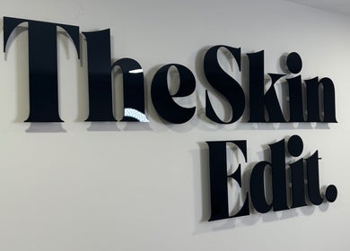 Sleek text logo of The Skin Edit on a wall in Hamilton, Scotland, GB.