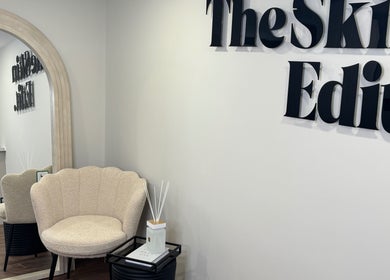 Elegant waiting area at The Skin Edit, Hamilton, Scotland, GB, featuring a cozy chair and decor.