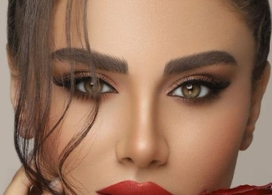 Close-up of elegant makeup with red lipstick at Make Up by Niloo, London, GB.