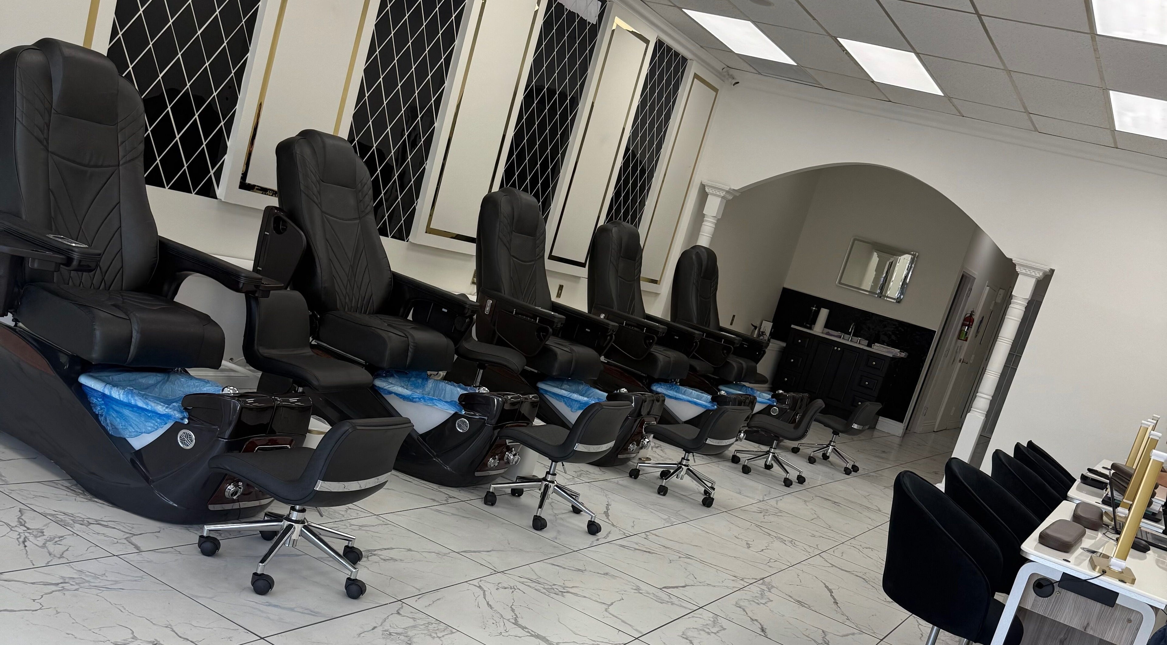 Elegant pedicure chairs at Aphina Nail Salon in Burbank, California, US, offer a serene spa experience.