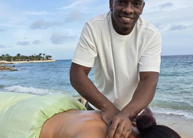 Relaxing beach massage at Body Delight Curacao in Willemstad, CW, showcasing serene ocean view and expert care.