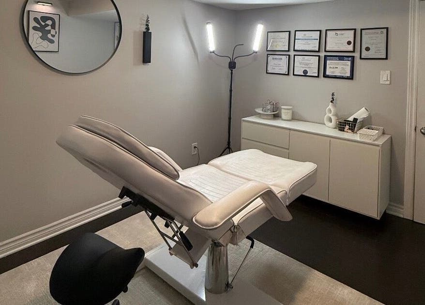 Elegant treatment room at RayanBeautyy - Ottawa, featuring a plush chair and decor. Located in Ottawa, Ontario, CA.