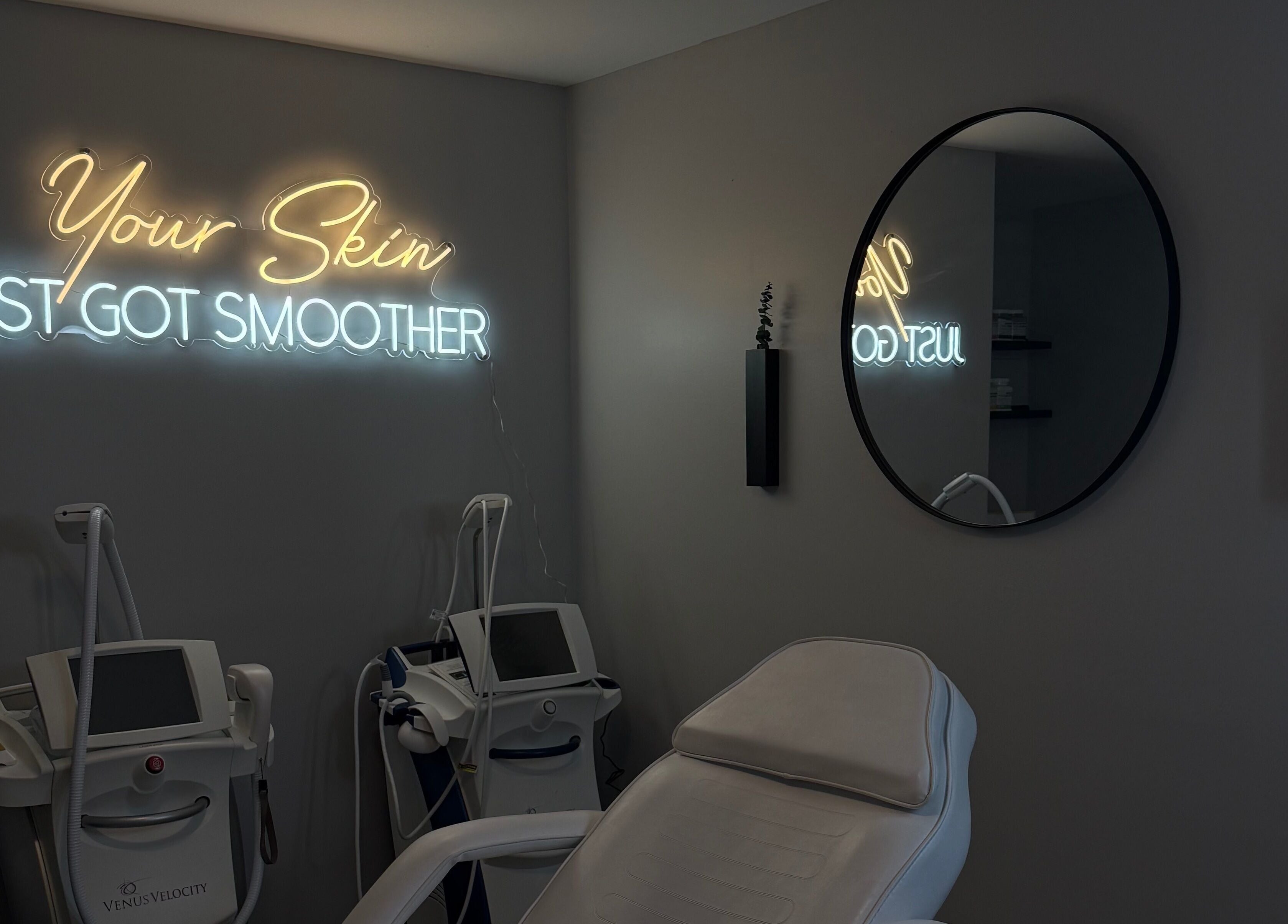 Tranquil treatment room at RayanBeautyy - Ottawa, Ottawa, Ontario, CA with modern equipment and neon sign.