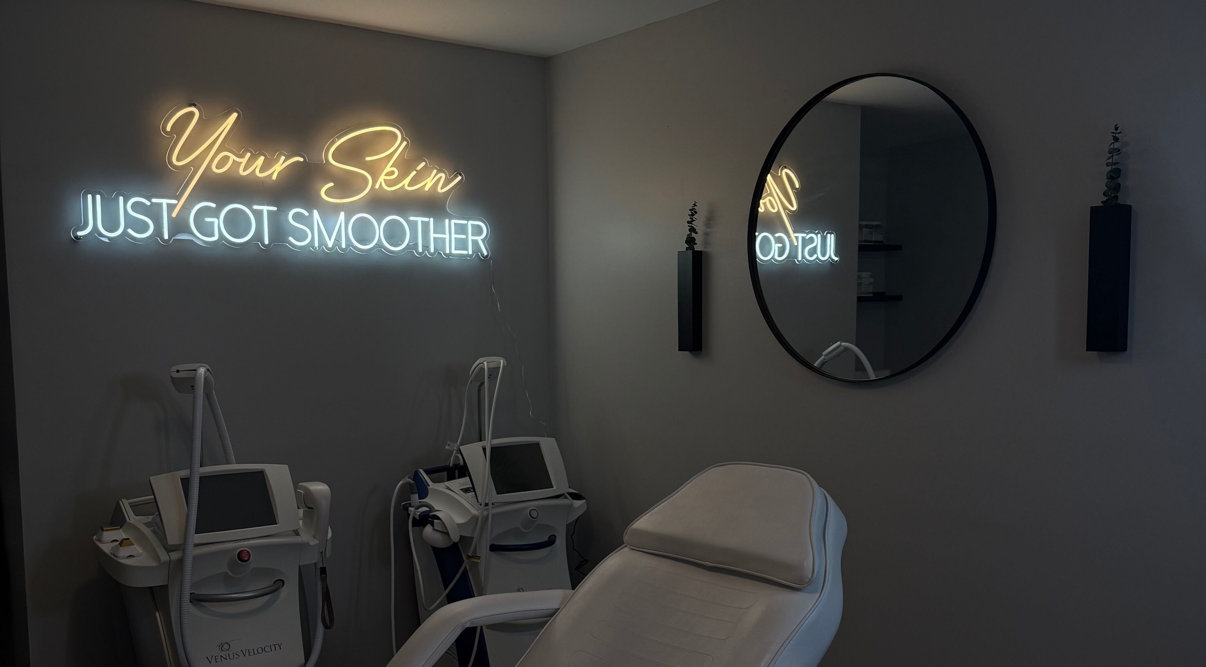 Tranquil treatment room at RayanBeautyy - Ottawa, Ottawa, Ontario, CA with modern equipment and neon sign.