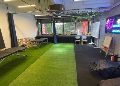 Relaxing therapy room at FU HOUSE RECOVERY, Kuala Lumpur, Malaysia, showcasing treatment beds and vibrant lighting.