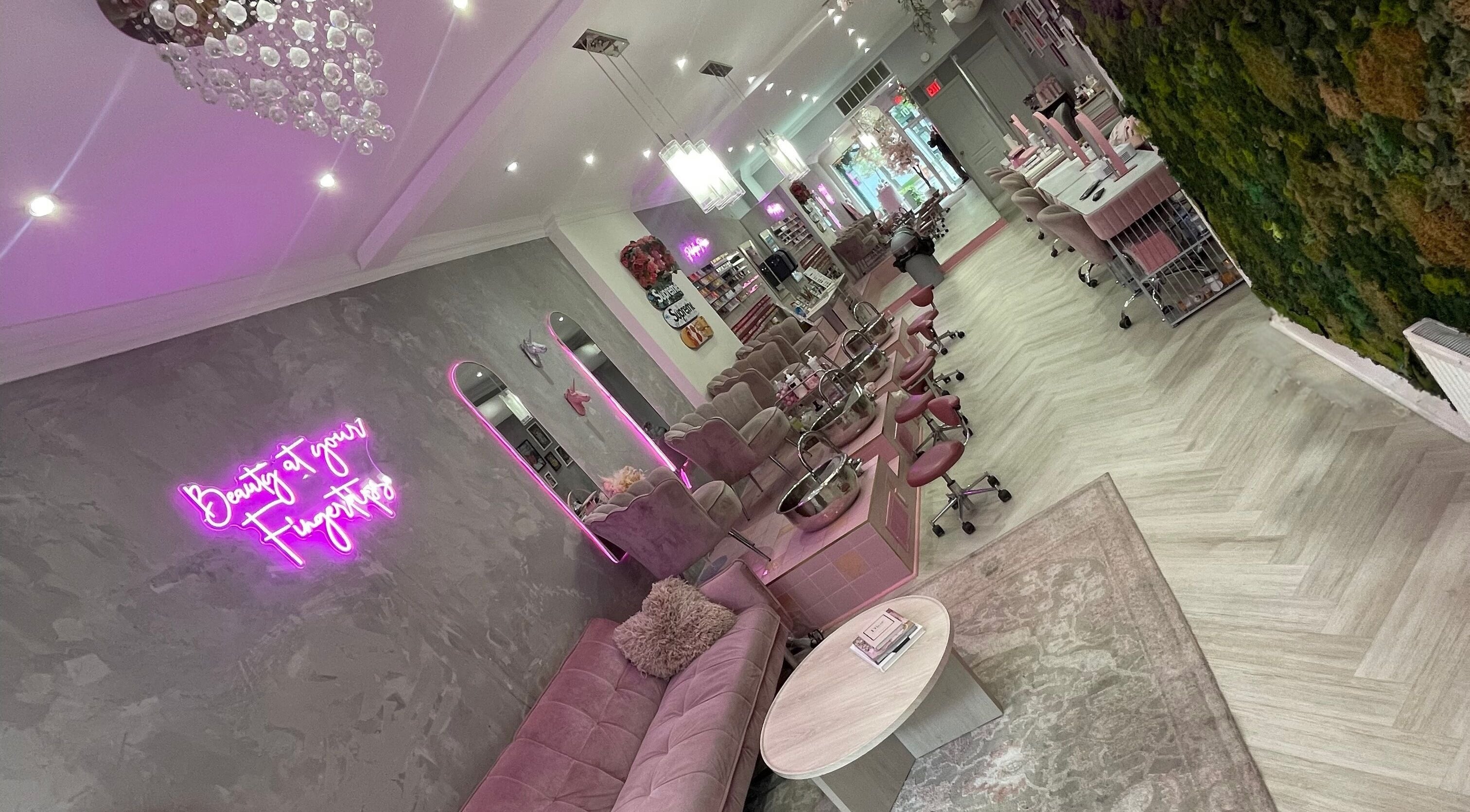 Elegant Top Coat salon in Toronto, Ontario, CA featuring plush seating and vibrant decor for beauty services.