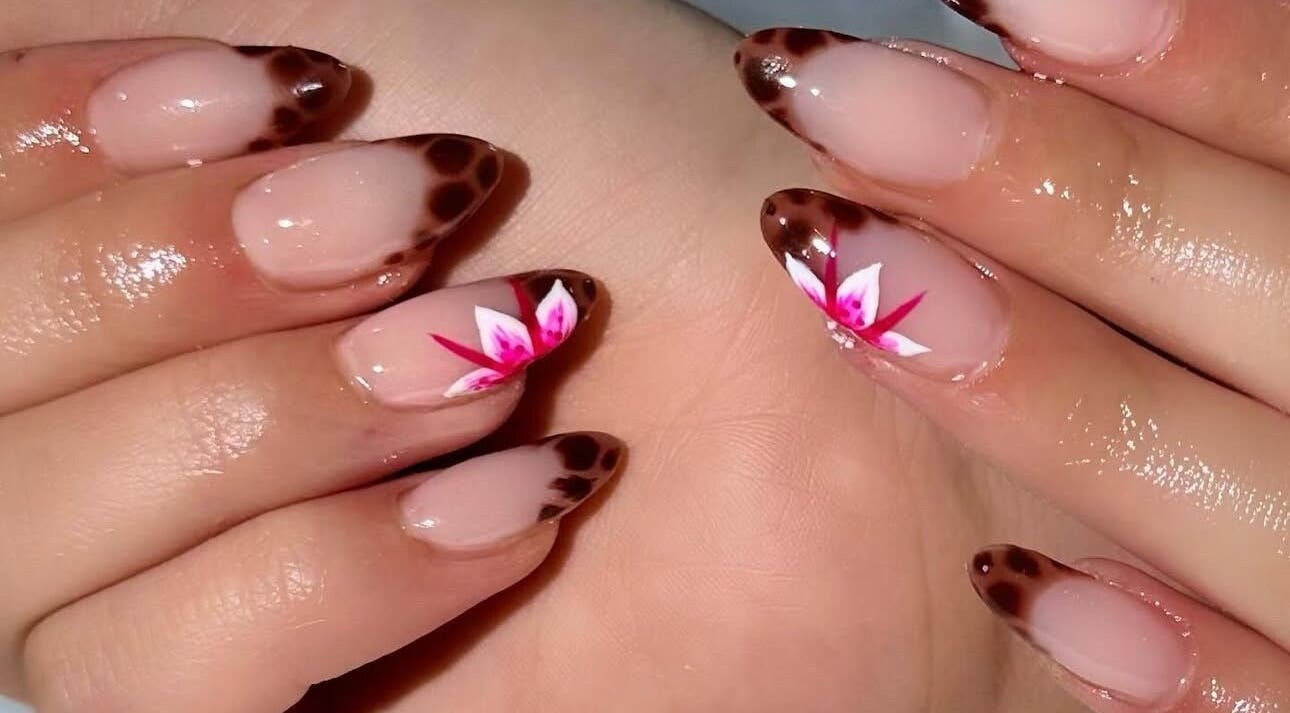 Stunning floral nail art at deznaillss in El Paso, Texas, US, featuring intricate designs and glossy finish.