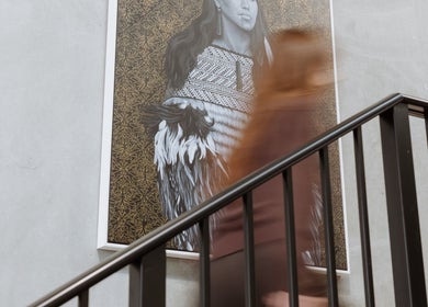 Blurred person walking past artistic portrait at Drader Brows, Auckland, Auckland, NZ.