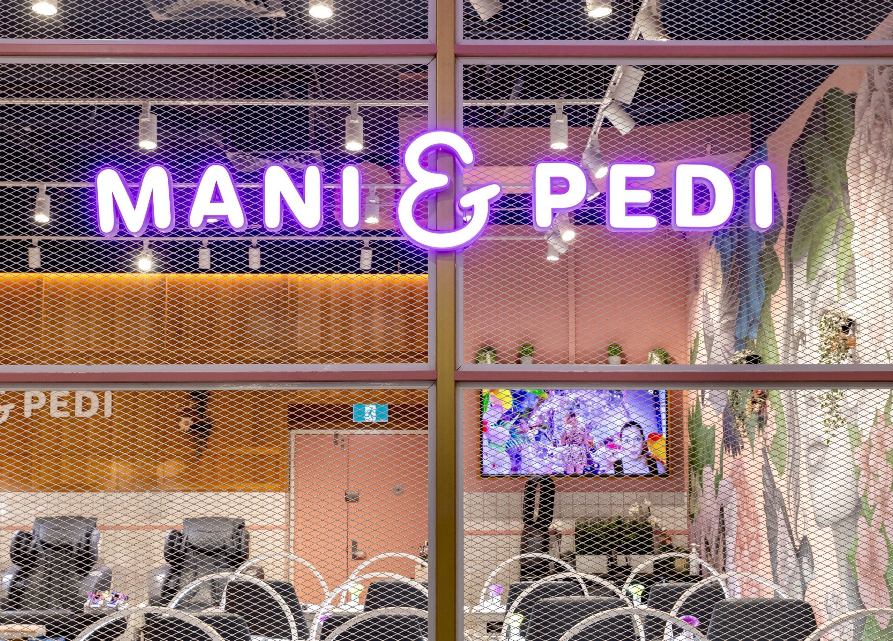 Vibrant sign of Mani Pedi Nail Salon Colonnades in Noarlunga Centre, South Australia, AU.
