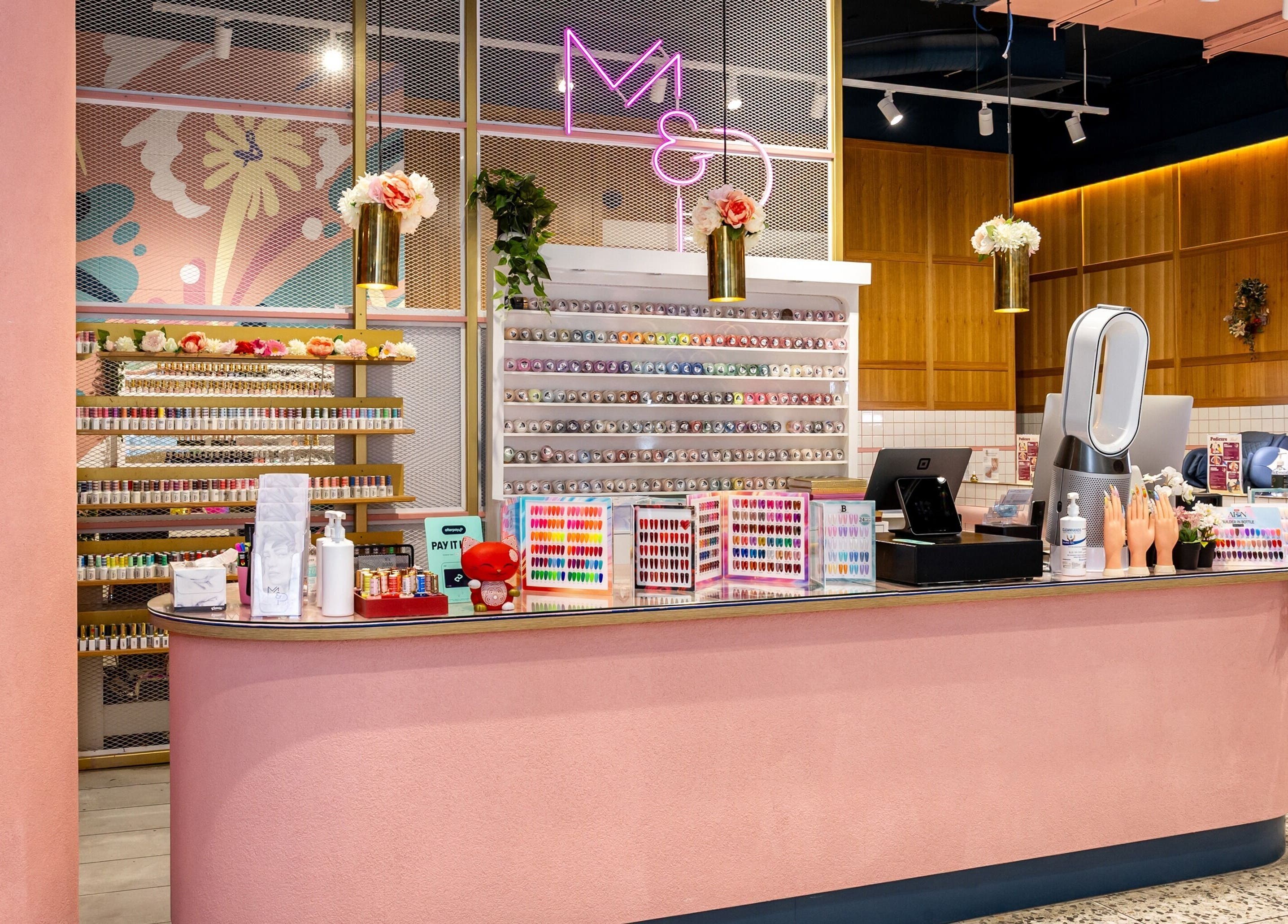 Mani Pedi Nail Salon Colonnades, vibrant nail polish display in Noarlunga Centre, South Australia, AU.