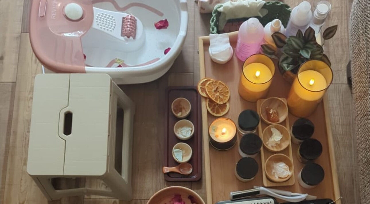 Foot bath and candles at Fusion Spa & Salon UK, Slough, England, GB enhancing relaxation ambiance.
