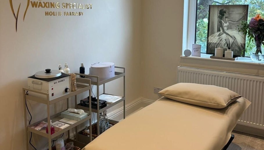 Cozy waxing room at Femme Waxing Specialist Hollie Farnaby, Leeds, England, GB, featuring a relaxing treatment bed.