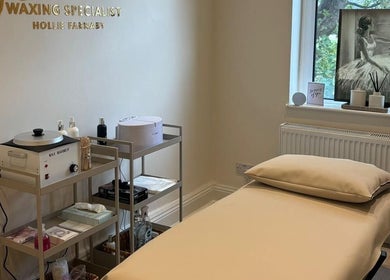 Cozy waxing room at Femme Waxing Specialist Hollie Farnaby, Leeds, England, GB, featuring a relaxing treatment bed.