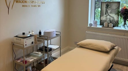 Cozy waxing room at Femme Waxing Specialist Hollie Farnaby, Leeds, England, GB, featuring a relaxing treatment bed.