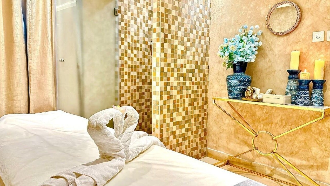 Relaxing spa room at Bustan Al Hana Ladies Salon, Dubai, Dubai, AE, featuring elegant decor and cozy massage table.