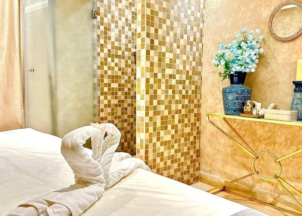 Relaxing spa room at Bustan Al Hana Ladies Salon, Dubai, Dubai, AE, featuring elegant decor and cozy massage table.