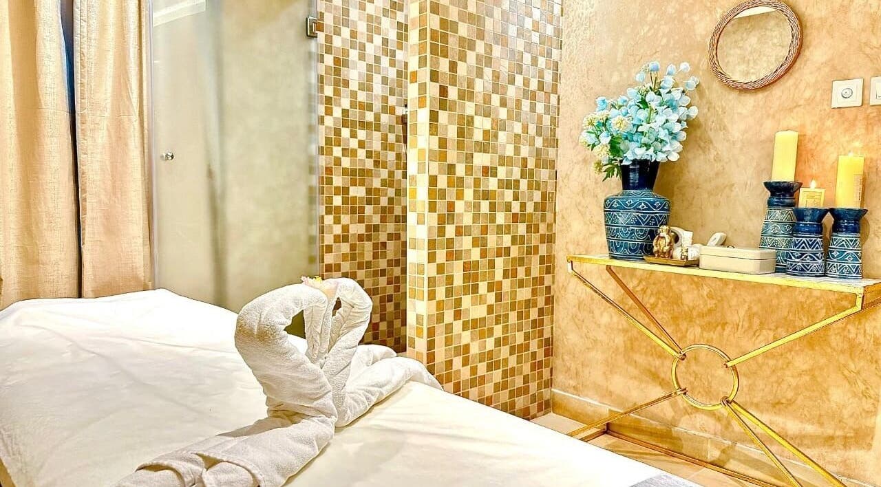 Relaxing spa room at Bustan Al Hana Ladies Salon, Dubai, Dubai, AE, featuring elegant decor and cozy massage table.