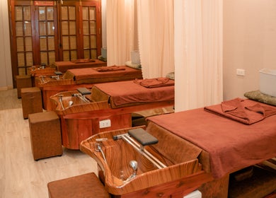 Relaxing massage beds at Lá Spa Ha Noi - Massage Gội Dầu Dưỡng Sinh, Hà Nội, VN, featuring warm ambiance.