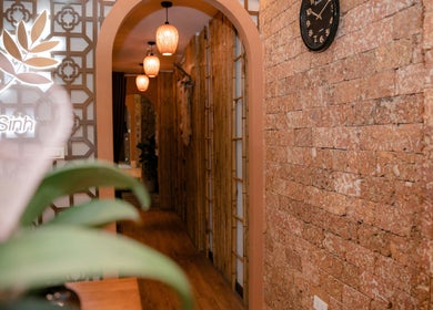 Elegant hallway at Lá Spa Ha Noi - Massage Gội Dầu Dưỡng Sinh, Hà Nội, VN with warm lighting and decor.
