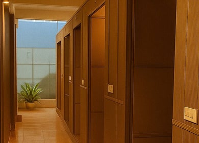 Tranquil hallway at Lá Spa - Massage Shampoo Hanoi, Hà Nội, Hà Nội, VN, featuring soft lighting and modern design.