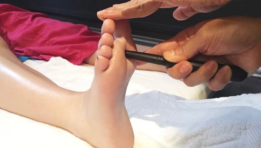 Foot massage tool in use at Cheeva thai masszázs, Budapest, Magyar, HU enhancing relaxation and wellness.