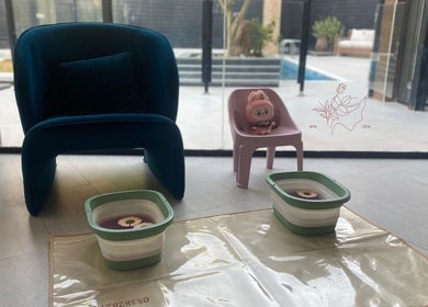 Relaxing foot soak setup at MMSPA - Home Service, Riyadh, SA, featuring a cozy seating area.