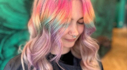 Vibrant rainbow hair styled at Bleach Brat, Ellon, Scotland, GB, showcasing pastel hues in a serene setting.