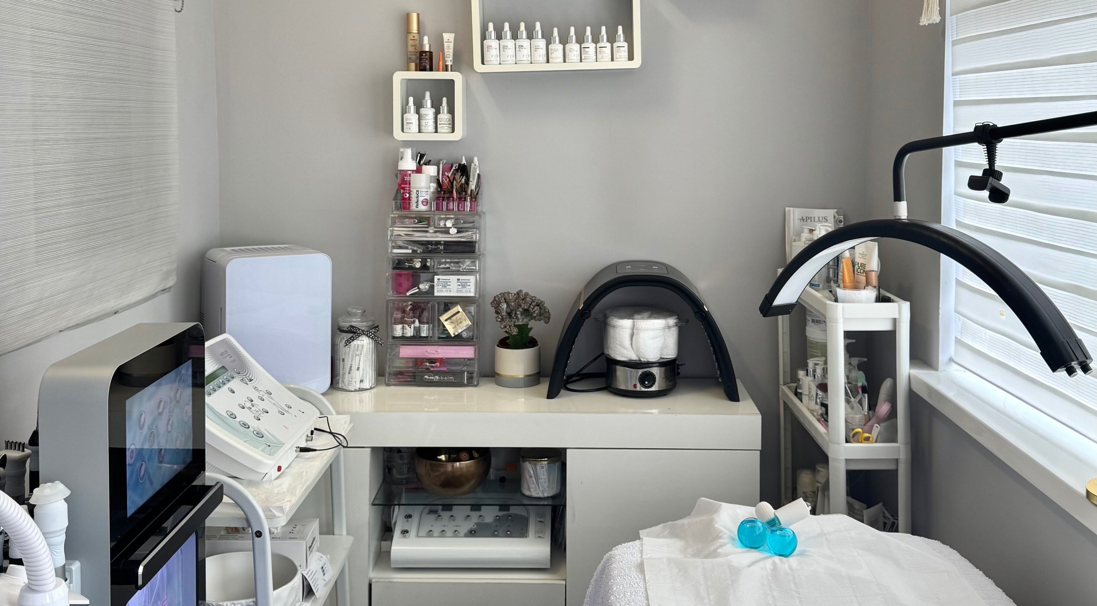 Modern interior of Ladies Beauty Room in London, England, GB, featuring skincare products and advanced equipment.