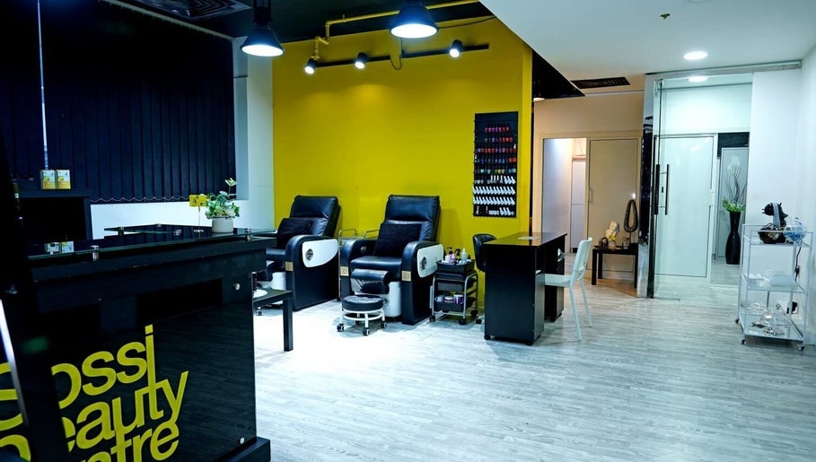Modern interior of Sossi Beauty Center spa lounge in Abu Dhabi, AE with sleek chairs and vibrant decor.