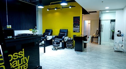 Modern interior of Sossi Beauty Center spa lounge in Abu Dhabi, AE with sleek chairs and vibrant decor.