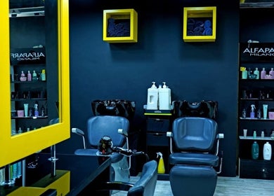 Modern salon station with products at Sossi Beauty Center, Abu Dhabi, AE, showcasing washing and seating area.