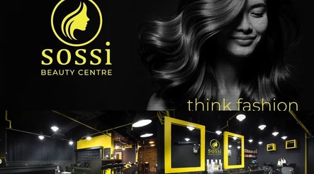 Elegant interior of Sossi Beauty Center in Abu Dhabi, AE featuring modern styling stations and ambient lighting.
