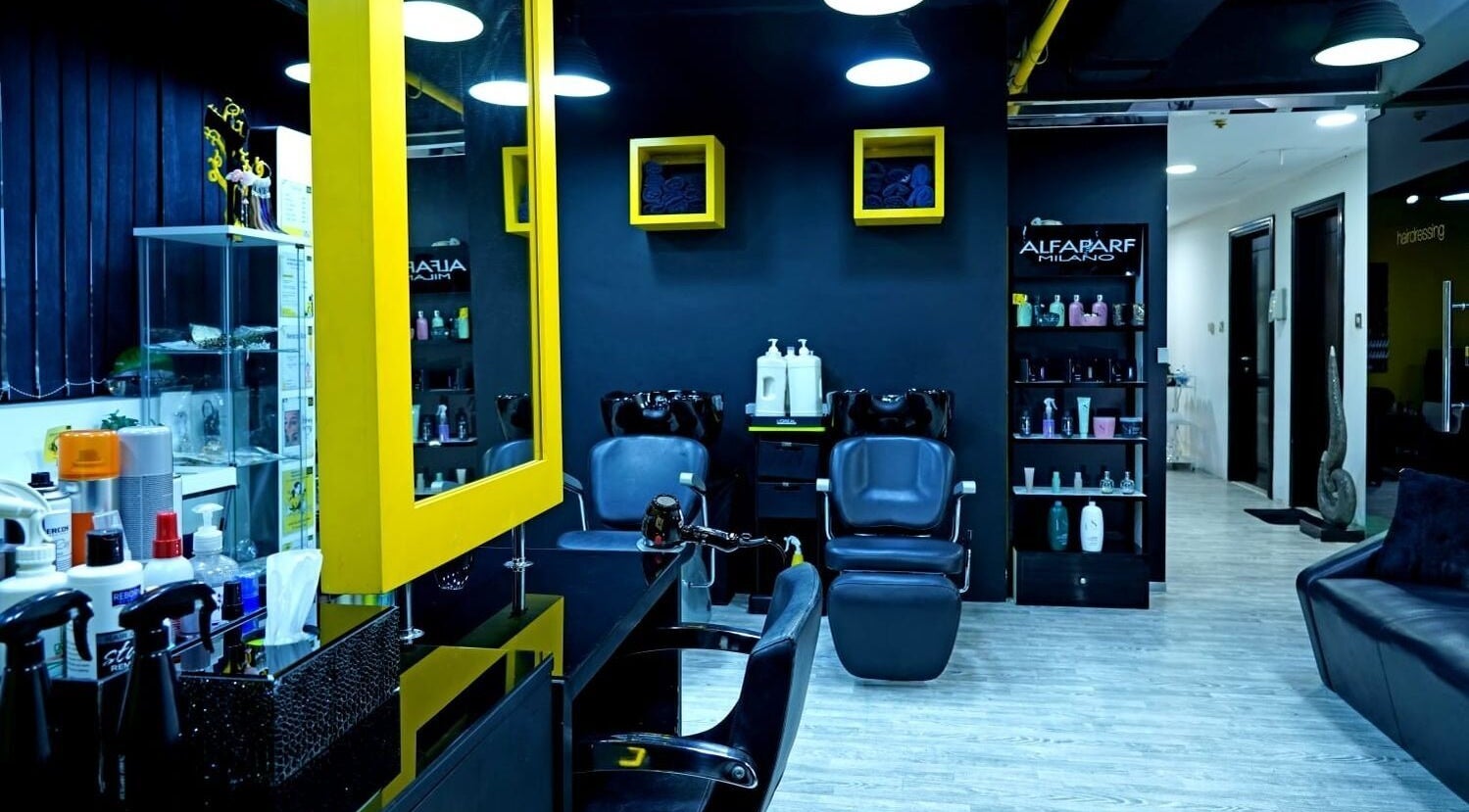 Interior of Sossi Beauty Center in Abu Dhabi, AE, featuring modern salon chairs and vibrant decor.