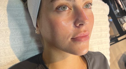 Woman receiving facial treatment at 7blessingsbeauty, Liverpool, England, GB for a glowing complexion.