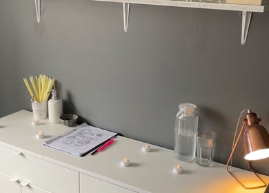 Cozy beauty setup at The Beauty Vault, Liversedge, England. Relaxing ambiance with candles and calming decor.